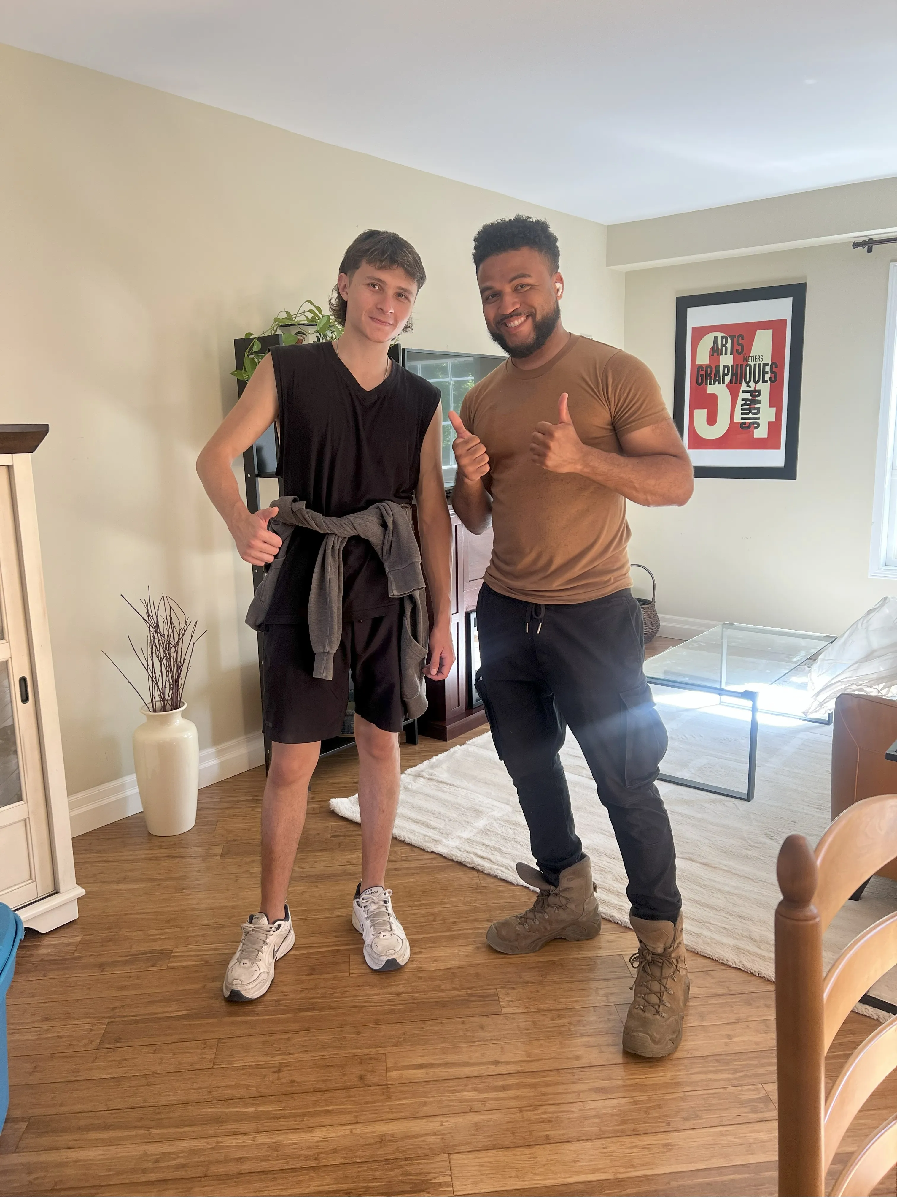 David and Julian from Olympus Movers posing together for a picture after a hard days work